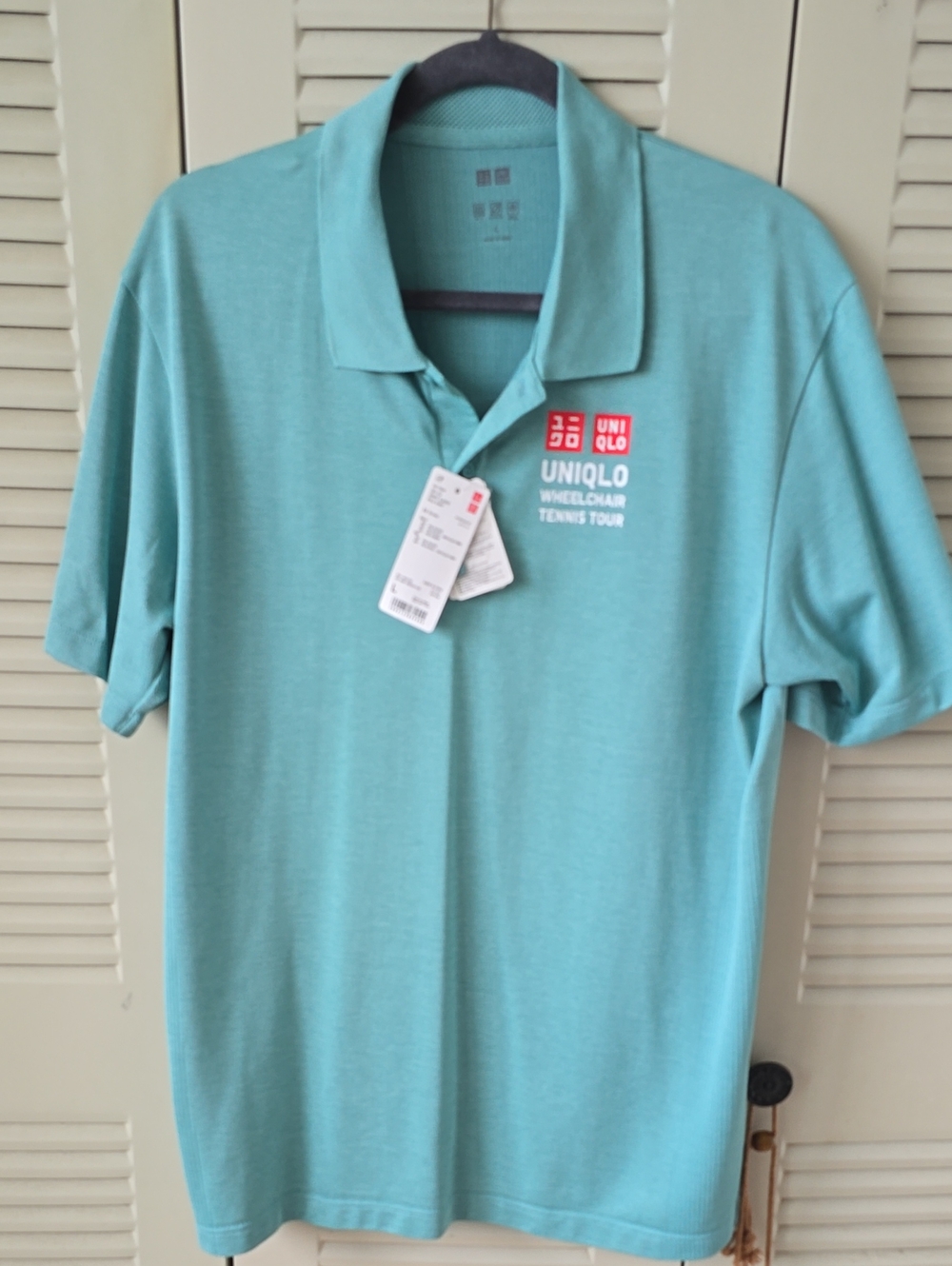 Uniqlo Men's Teal Polo Shirt with Wheelchair Tennis Tour Logo